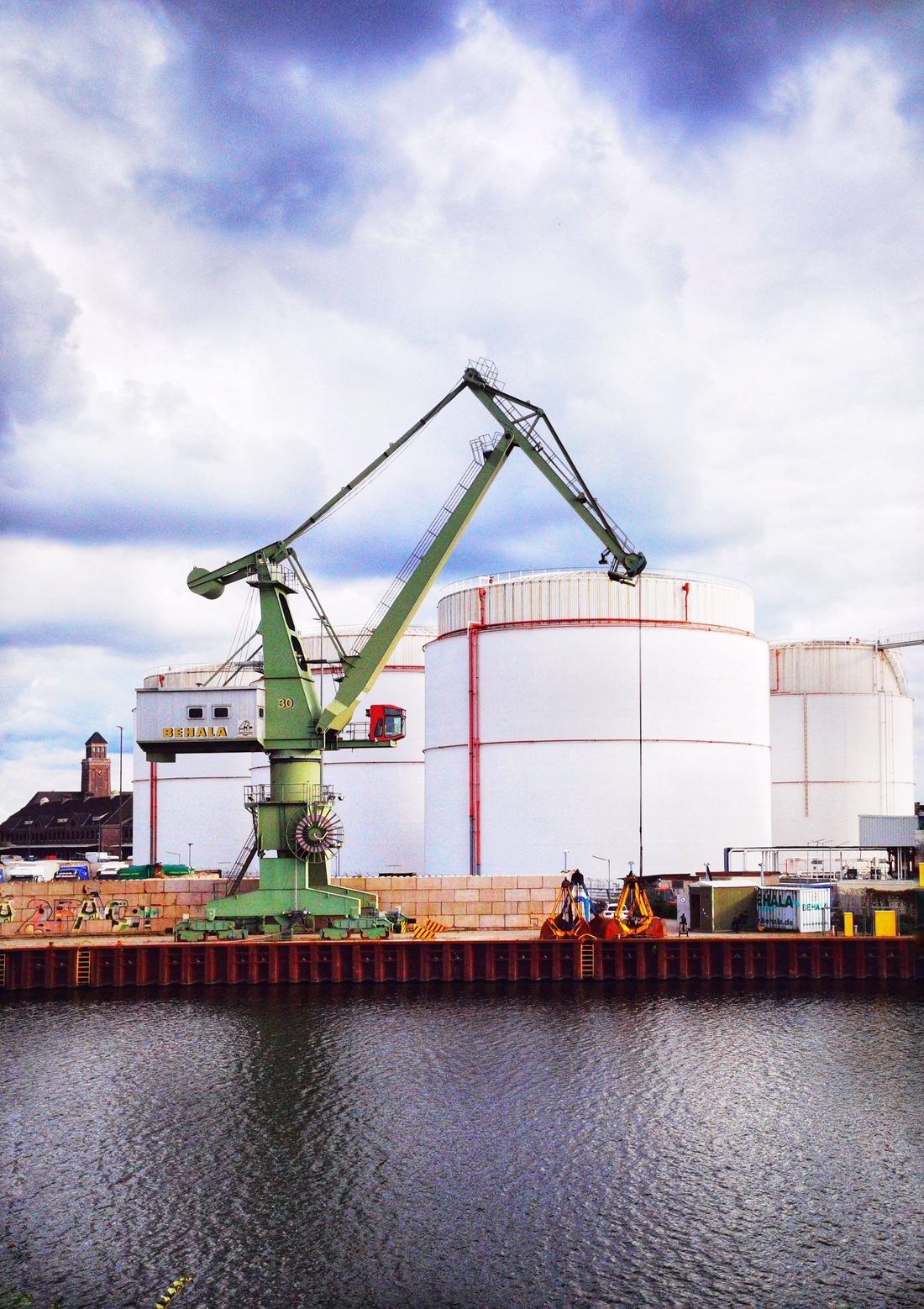 Terminal operator inspecting bulk storage tanks and pipework